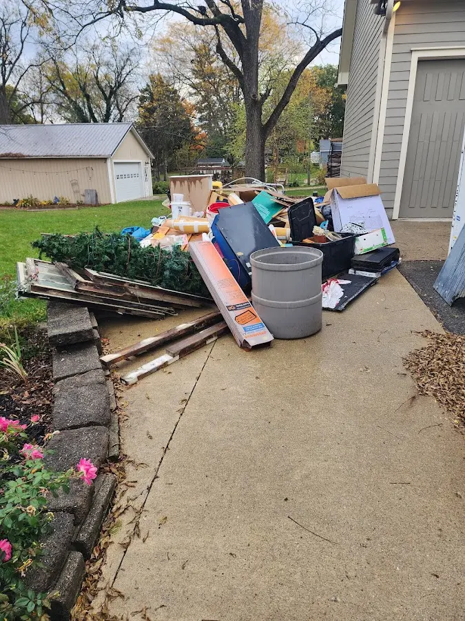 Dumpster being loaded with debris for Commercial Dumpster Rental in Red Wing